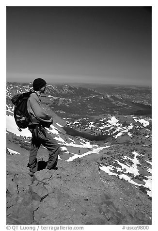 Hiker standing on top of Round Top Mountain. Mokelumne Wilderness, Eldorado National Forest, California, USA (black and white)