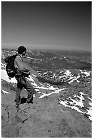 Hiker standing on top of Round Top Mountain. Mokelumne Wilderness, Eldorado National Forest, California, USA ( black and white)