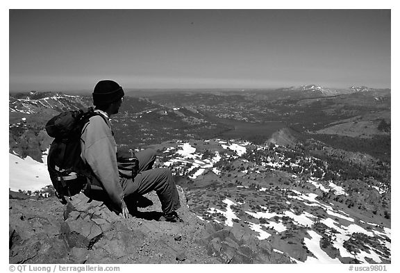 Hiker sitting  on top of Round Top Mountain. Mokelumne Wilderness, Eldorado National Forest, California, USA (black and white)