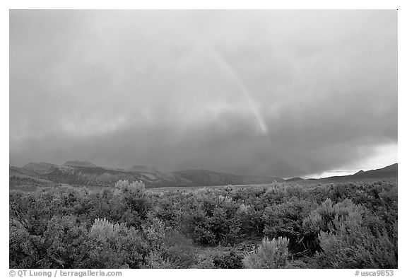 Rainbow and storm over Mono Basin, evening. Mono Lake, California, USA