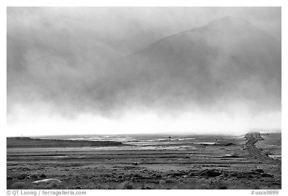 Mineral deposits of dry lake stirred up by a windstorm, Owens Valley. California, USA (black and white)