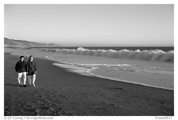 Couple strolling on the beach, late afternoon. Point Reyes National Seashore, California, USA (black and white)