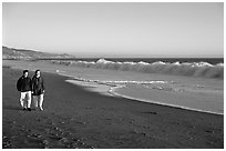 Couple strolling on the beach, late afternoon. Point Reyes National Seashore, California, USA (black and white)