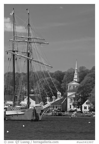 Tall ship and white steepled church. Mystic, Connecticut, USA (black and white)