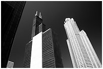 Sears tower and other skyscrappers towering in the sky. Chicago, Illinois, USA ( black and white)