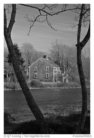 Historic house next to pond, Sandwich. Cape Cod, Massachussets, USA (black and white)