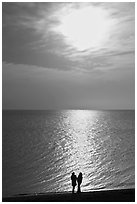 Couple and late afternoon sun, Herring Cove Beach, Cape Cod National Seashore. Cape Cod, Massachussets, USA (black and white)