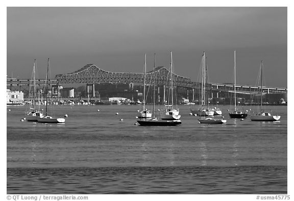 Harbor with anchored boats and bridge. Boston, Massachussets, USA (black and white)