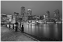 Night skyline above harbor. Boston, Massachussets, USA (black and white)