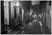 Picturesque cobblestone street on rainy night, Beacon Hill. Boston, Massachussets, USA (black and white)