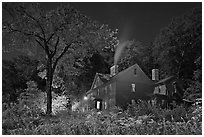 Orchard House at night with smoking chimney, Concord. Massachussets, USA ( black and white)