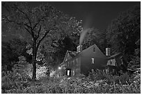 Orchard House at night with smoking chimney, Concord. Massachussets, USA (black and white)