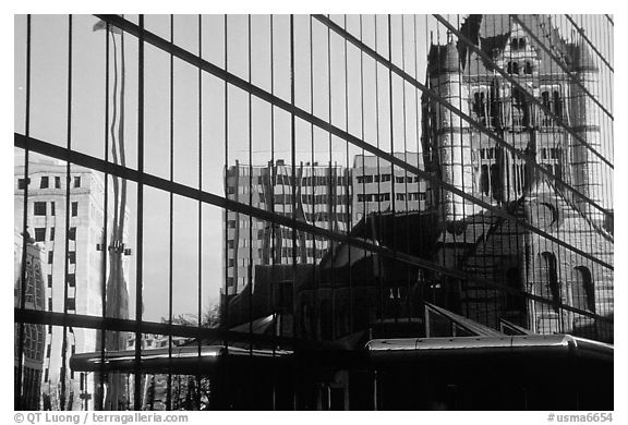 Historic church reflected in a modern glass building. Boston, Massachussets, USA (black and white)