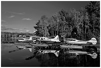 Floatplanes and reflections in Moosehead Lake  late afternoon, Greenville. Maine, USA (black and white)