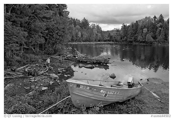 Cove and boat on shore of  Moosehead lake, Lily Bay State Park. Maine, USA (black and white)