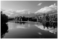 Calm Penobscot River reflects Katahdin range in the fall. Maine, USA (black and white)