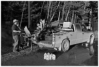 Hunters with moose in back of truck. Maine, USA ( black and white)