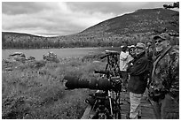 Wildlife photographers on observation platform, Sandy Stream Pond. Baxter State Park, Maine, USA (black and white)