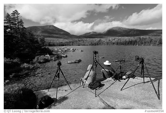 Photographers at Sandy Stream Pond waiting with cameras set up. Baxter State Park, Maine, USA (black and white)