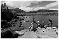 Photographers at Sandy Stream Pond waiting with cameras set up. Baxter State Park, Maine, USA (black and white)
