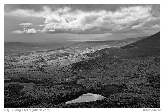 View with storm light and clouds over slopes covered with fall foliage. Baxter State Park, Maine, USA (black and white)