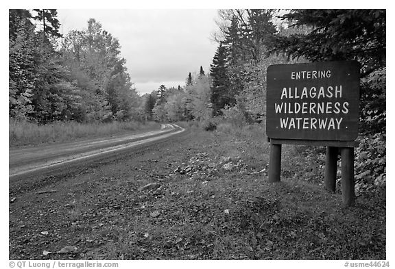 Road with Allagash wilderness sign. Allagash Wilderness Waterway, Maine, USA (black and white)