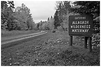 Road with Allagash wilderness sign. Allagash Wilderness Waterway, Maine, USA (black and white)