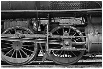 Wheels and pistons of vintage locomotive. Allagash Wilderness Waterway, Maine, USA (black and white)