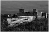 Stacks of finished lumber at dusk,  Ashland. Maine, USA ( black and white)