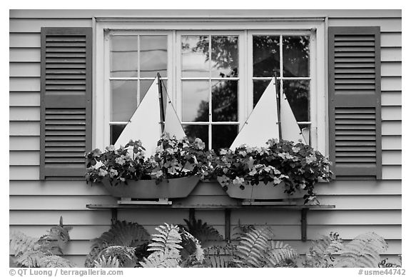 Window with flower pots shaped like sailboats. Bar Harbor, Maine, USA (black and white)