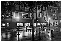 Street with wet pavement at night. Bar Harbor, Maine, USA (black and white)