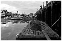 Lobster traps and fishing boats below pier. Portland, Maine, USA ( black and white)