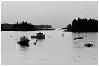 Boats and Penobscot Bay islets, sunrise. Stonington, Maine, USA ( black and white)