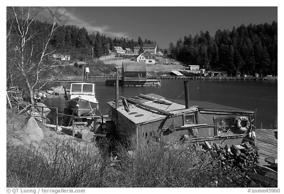 Old schack and harbor. Stonington, Maine, USA (black and white)