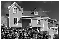 Lobster traps lined in front of house. Stonington, Maine, USA ( black and white)