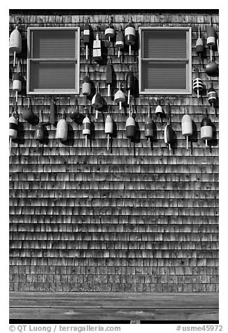 Facade decorated with buoys. Maine, USA (black and white)