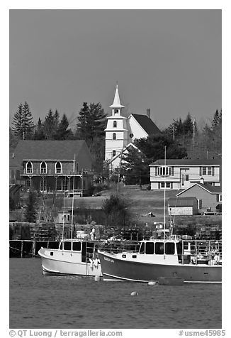 Lobster boats and village church. Corea, Maine, USA (black and white)