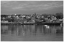 Harber and hillside houses at sunrise. Stonington, Maine, USA ( black and white)