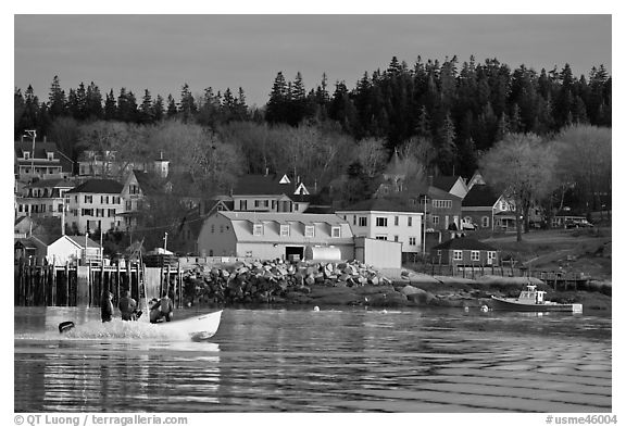 Men on small boat in harbor. Stonington, Maine, USA (black and white)