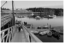 Passengers headed towards mailboat. Isle Au Haut, Maine, USA ( black and white)
