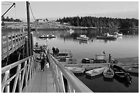 Passengers headed towards mailboat. Isle Au Haut, Maine, USA (black and white)