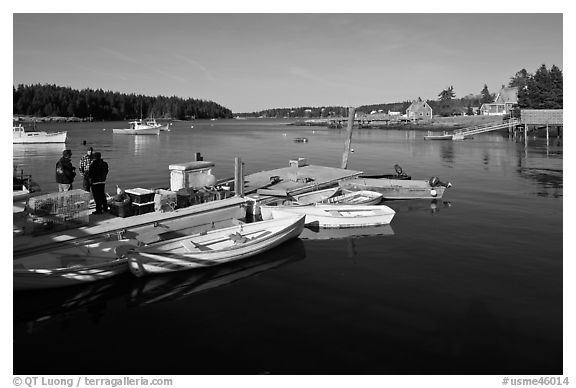 Small boats, harbor and village. Isle Au Haut, Maine, USA (black and white)