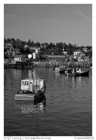 Traditional lobster boats and houses, late afternoon. Stonington, Maine, USA (black and white)