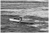 Fishermen on lobster boat. Bar Harbor, Maine, USA (black and white)