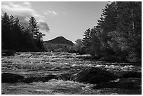 Haskell Rock Pitch cascades and Bald Mountain framed by trees in autumn foliage. Katahdin Woods and Waters National Monument, Maine, USA ( black and white)