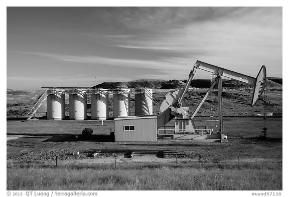 Pumping unit and tanks, oil well. North Dakota, USA