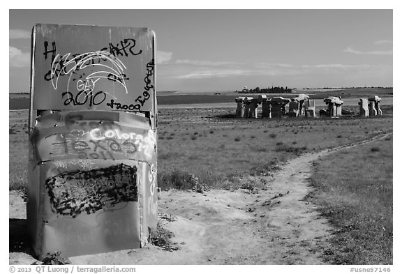 Car sculpture and distant car circle, Carhenge. Alliance, Nebraska, USA