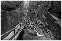 Hiking the Flume in the rain, Franconia Notch State Park. New Hampshire, USA (black and white)