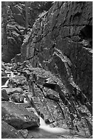 Flume brook at the base of granite and basalt walls, Franconia Notch State Park. New Hampshire, USA (black and white)