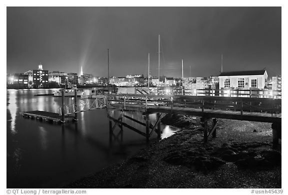 Pier and skyline by night. Portsmouth, New Hampshire, USA (black and white)